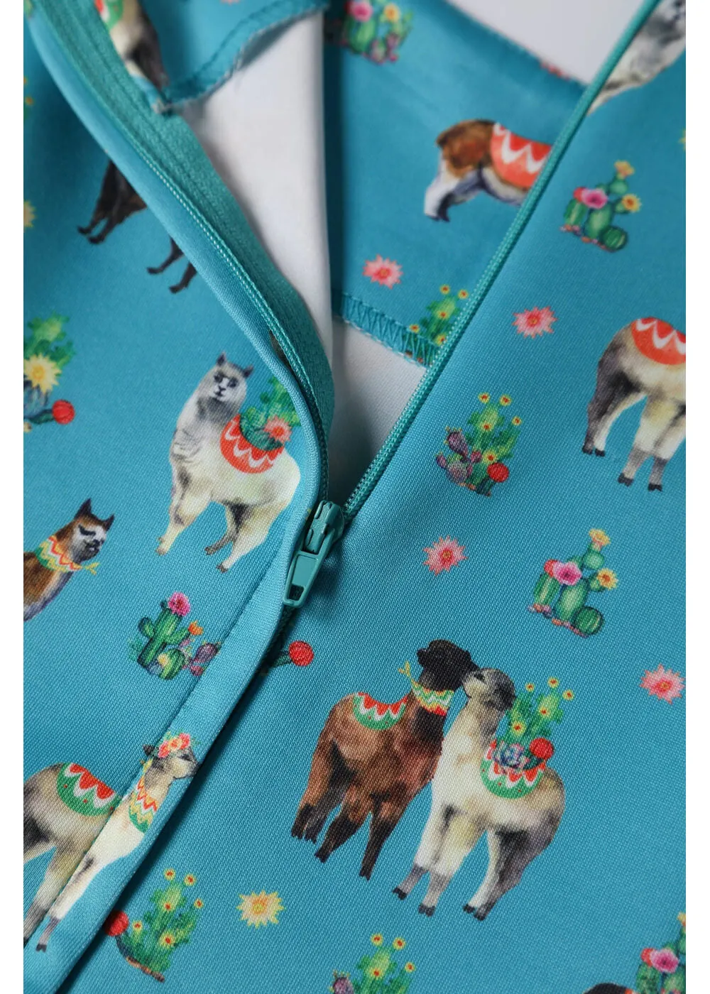 Retro Turquoise Swing Dress with Llama Design by Dolly & Dotty